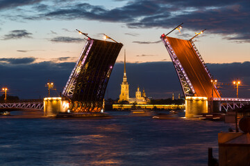 Fototapeta na wymiar Russia. Open Palace Bridge and view of the Peter and Paul Fortress in St.Petersburg in white night