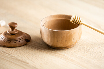 A spoon of honey on the wood plate