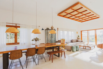 Modern summer holiday or vacation wooden beach house living room interior with rustic luxury sofas, tables and decoration. 