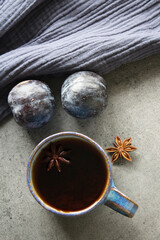 Top view photo of cup of tea on a table. Dark gray background with copy space. 