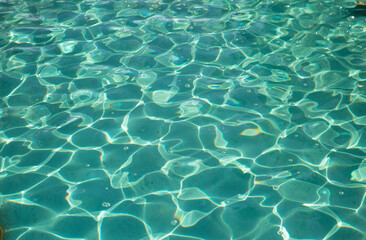 clear water pool with shine rays sun