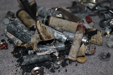 The flashlight batteries are dismantled.