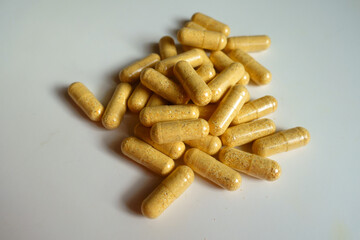 Group of orange cellulose capsules of multivitamins