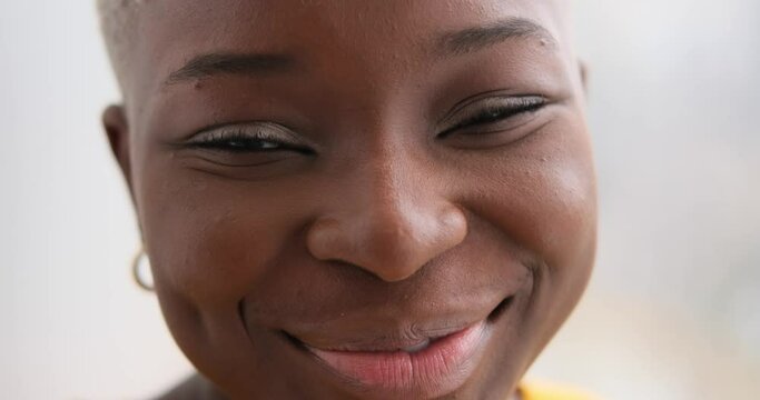 Face of african american woman smiling at home