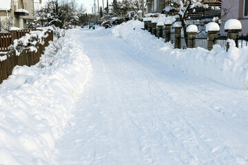 Snowy street of a small town on a frosty sunny day.