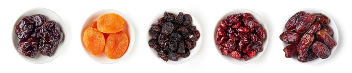Various dried fruits in bowl isolated on white, from above