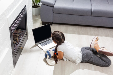 Photo of small pretty overjoyed pupil school girl notebook online lesson video call listen good...