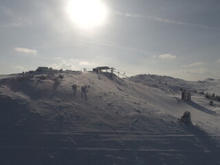 sunny winter day with fresh snow in ski resort