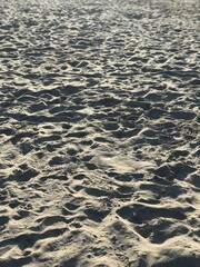 Footprints in the sand on a beach