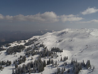 sunny winter day with fresh snow in ski resort