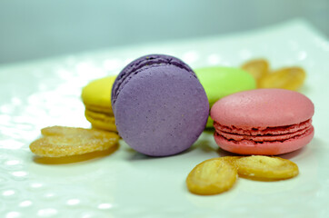 colorful macaroons on a wooden table
