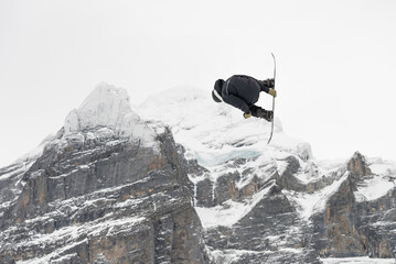 Snowboard ski freestyle big air contest in the background Mittelhorn mountain. Snowboard tricks,...