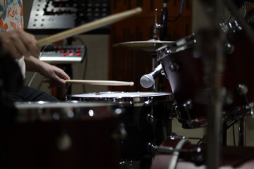 Drummer hitting a snare in the studio