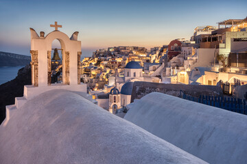 Fototapeta premium Santorini church in the village of Oia at sunset. Greece.