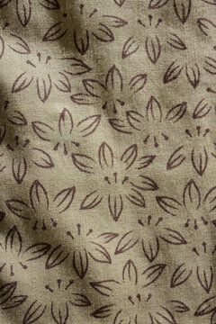 floral pattern with brown fabric garment. © Suthin