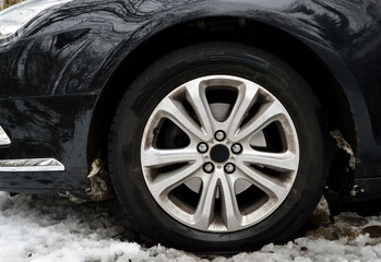 Fototapeta na wymiar Snow tires or tyres for driving on dangerous snowy roads during winter 