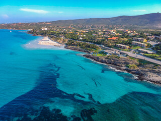 Spectacular landscape aerial view by Drone in Stintino, Spiaggia della Pelosa  - Sardegna in a sunny day with blue sky and and turquoise water,  Summer Season. Italian holiday.