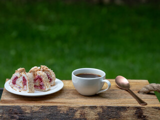 pavlova rolls cake and cup of coffee