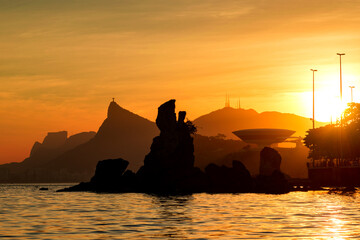 Warm Sunset With Corovado Mountain in the Horizon and Rocks in Guanabara Bay, Rio de Janeiro, Brazil