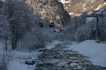 Gondola goes from the terminal in Grindelwald to Mannlichen. Ski lift in Switzerland Jungfrauregion.