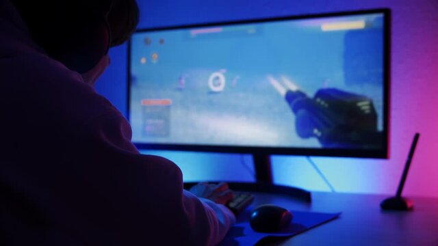 Twitch streamer gamer playing shooter online video game - Technology trends concept