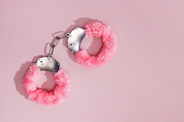 One pair of fluffy pink hand cuffs