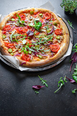 vegetable pizza tomato, onion, pickles, mushrooms vegan or vegetarian no meat portion on the table healthy meal snack outdoor top view copy space food background rustic 