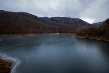 landscape with a lake in the mountains in winter