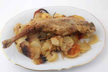lamb leg cooked with potatoes and onions © fotoXS
