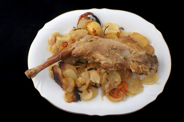 lamb leg cooked with potatoes and onions