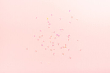 Delicate pink background with stars. The concept of femininity, fragility, women's day, the Day of St. Valentine, Christmas, New Year, holiday, birthday, etc.