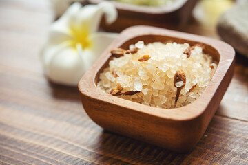Composition of spa treatment. Natuaral cosmetics with pink himalayan spa salt. Sea bath salt for spa relaxation on wooden background..