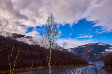 Fototapeta na wymiar landscape with a lake in the mountains in winter
