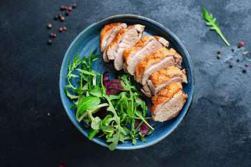 duck breast fried and salad leaves portion grill or barbecue roasted meat poultry on the table meal snack keto or paleo diet outdoor top view copy space for text food background rustic image 