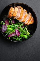 duck breast fried and salad leaves portion grill or barbecue roasted meat poultry on the table meal snack keto or paleo diet outdoor top view copy space for text food background rustic image 