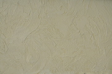 Fototapeta na wymiar decorative plaster, abstract drawing, beige color. for interior decoration. for background and texture