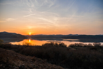 Fototapeta na wymiar Impressively beautiful lake in Korea. Epic image. Scenery lake landscape with sunset.