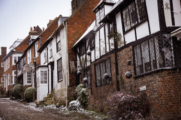 Fototapeta na wymiar Snowy cobbled street in Rye, East Sussex, England