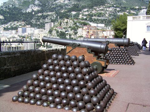 View towards a part of Monaco with cannons and iron balls in the foreground
