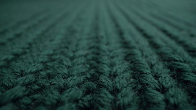 Close-up aquamarine color fabric knitted texture background.