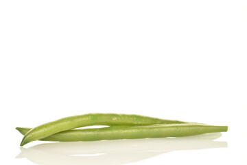 Two pods of bright green, organic, natural, ripe beans on a white background.