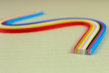 Colored quilling paper on a light background. Abstract background texture.