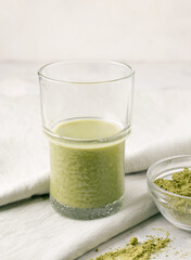 Green matcha tea on gray background