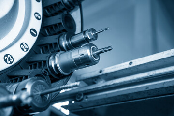 The solid  end mill tool in the tooling magazine of machining center. The automatic toll change ,ATC operation concept on the CNC milling machine. © Pixel_B