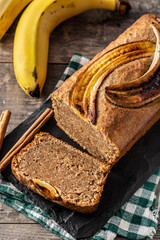 Homemade banana bread on rustic wooden table