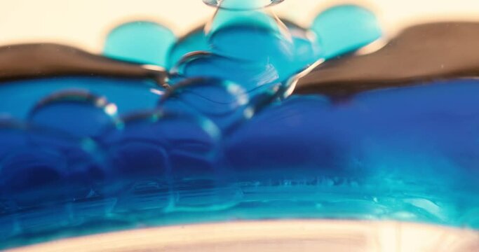 Blue Liquid Dripping on Surface
