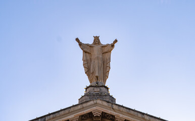 Statue Malta Church clock tower with bells in Valletta
