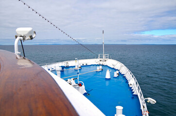 View over open outdoor deck of classic cruiseship or cruise ship liner at sea