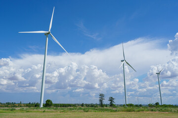 Fototapeta premium Wind turbine renewable energy source summer with blue sky