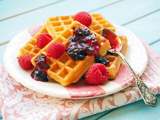 Traditional belgian waffles with raspberries